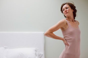 Боли в пояснице во время месячных